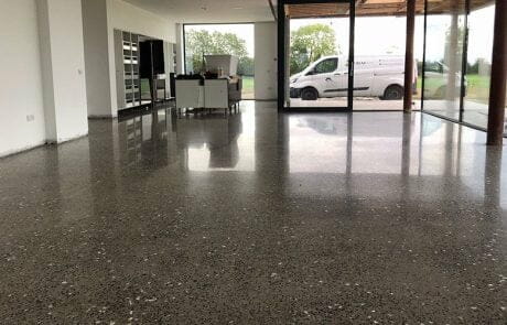 Polished concrete floor platinum finish with coloured glass