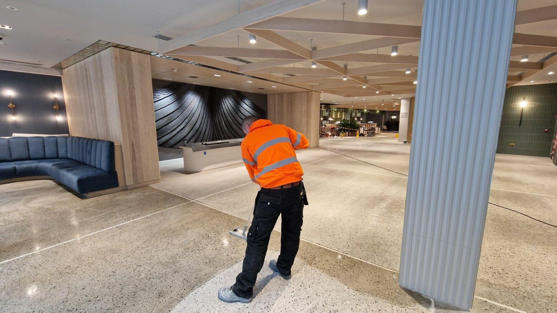 Operative applying sealer to concrete floor