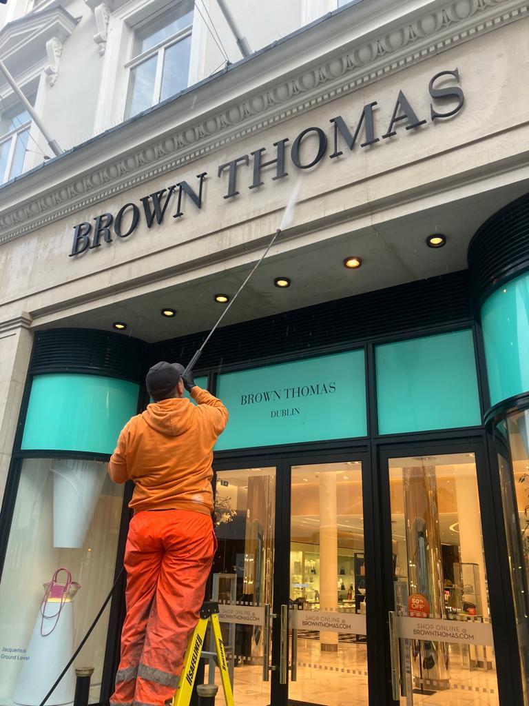 PMAC operatives cleaning the facade of Brown Thomas on Grafton st