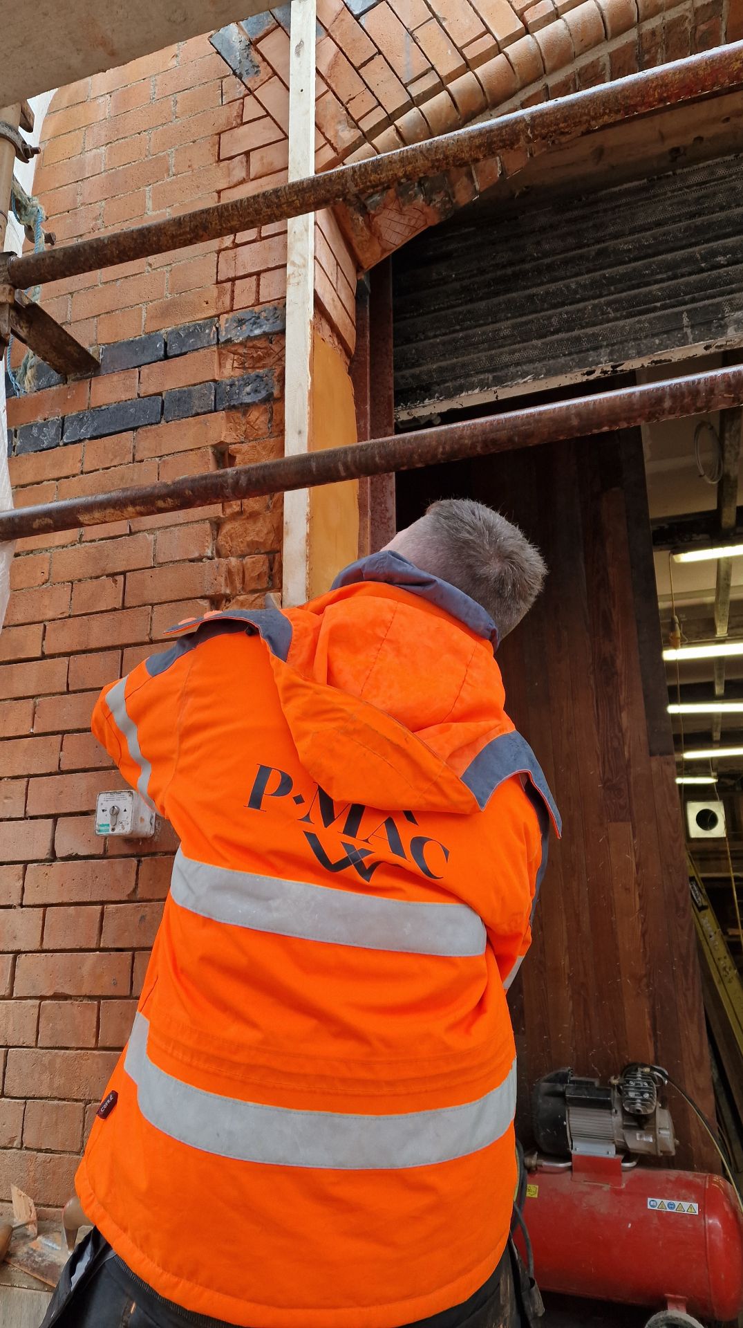 PMAC brick team repairing damaged brickwork