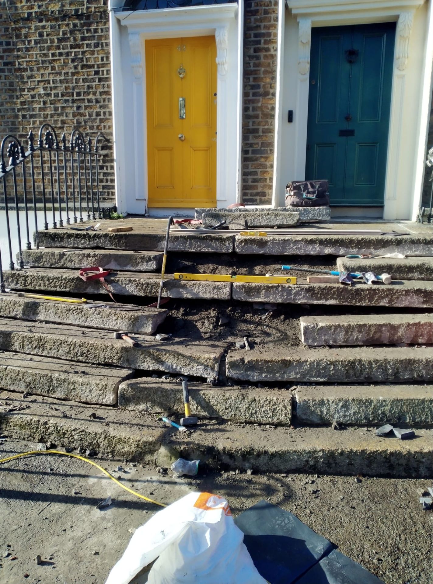 Front view of granite steps showing some stones removed so they can be made level