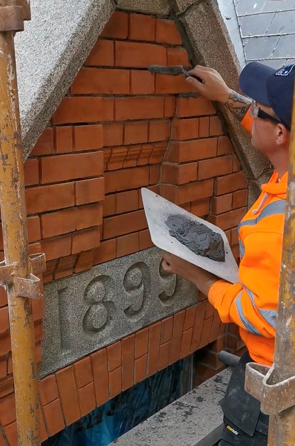 PMAC operative repointing a heritage building