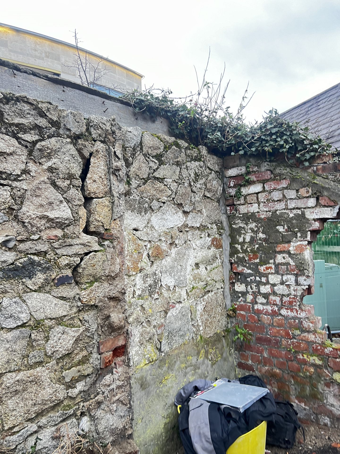 Old granite wall in state of disrepair