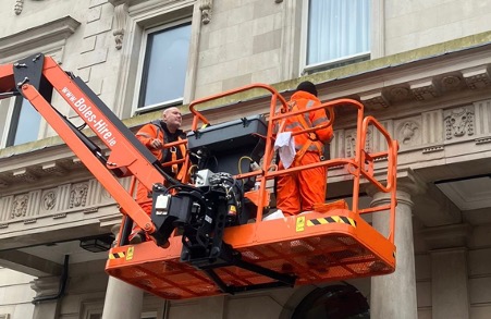 Removing graffiti with the aid of a MEWP from Boles Hire