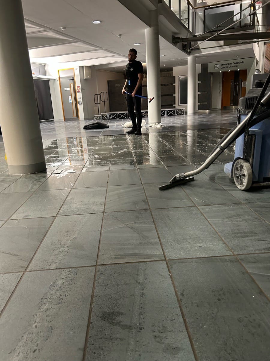 PMAC operator cleaning a commercial floor PMAC operator cleaning a commercial floor